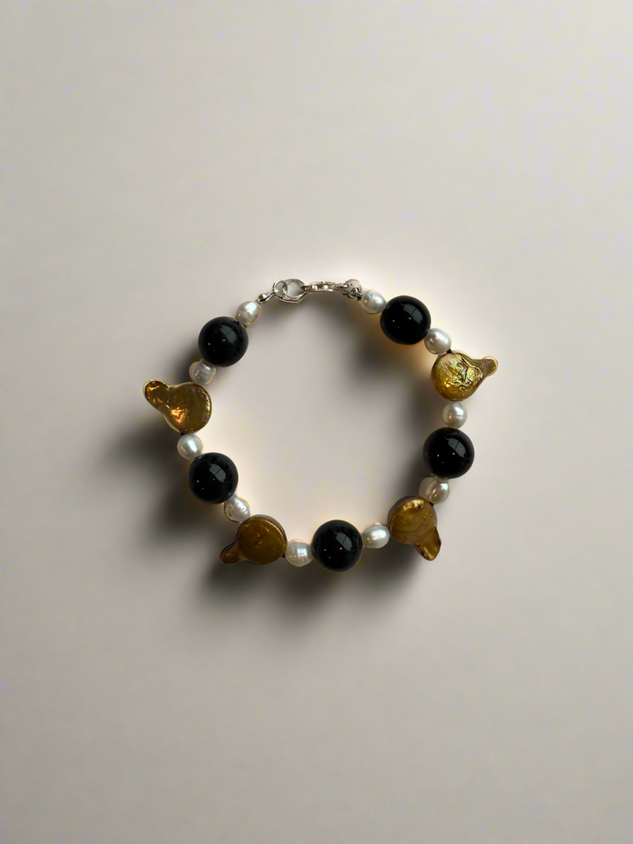 Tongue Tied Bracelet by Yam